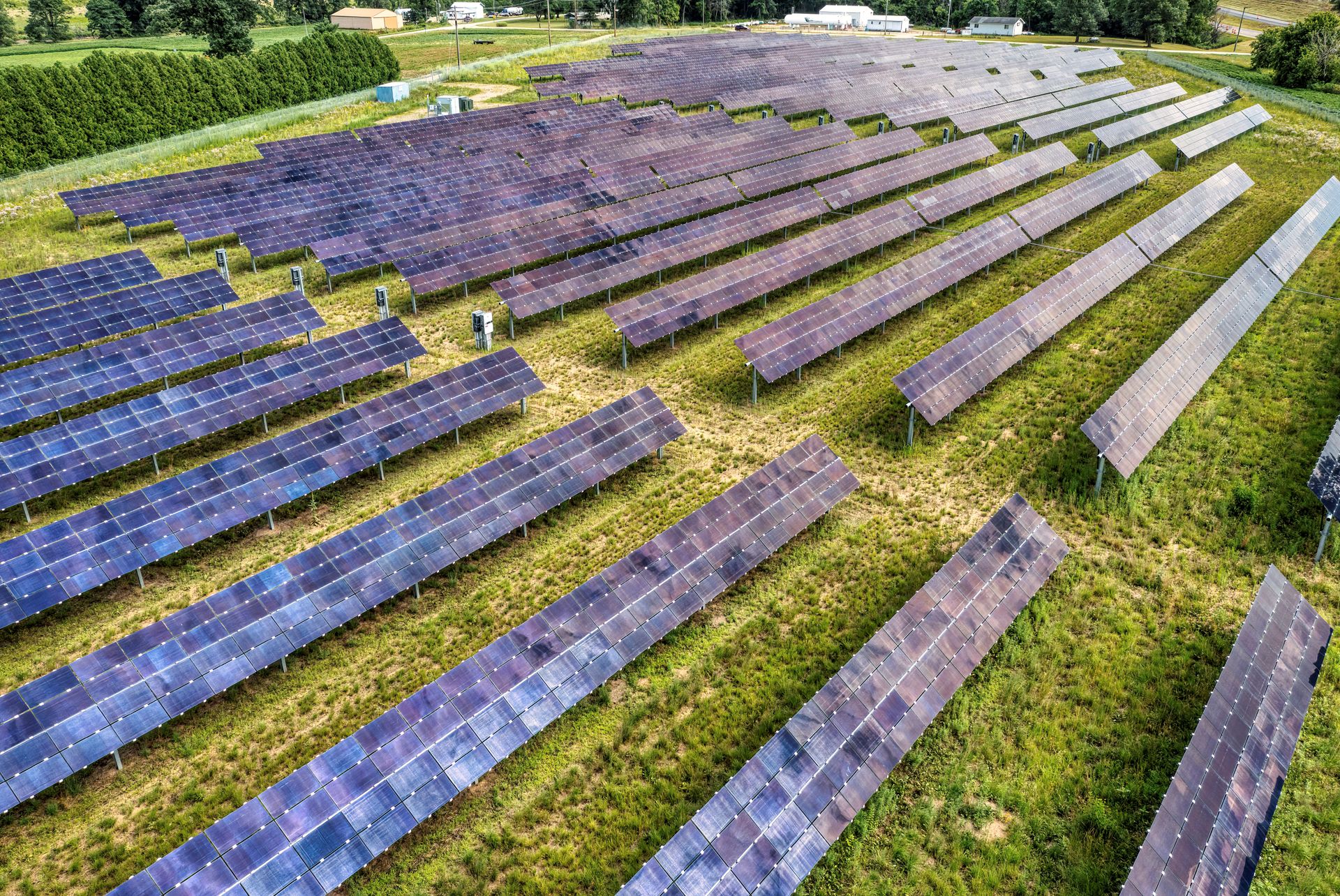 Aerial perspective of a solar farm showcasing renewable energy infrastructure.